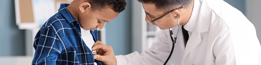 doctor listening to child's heart